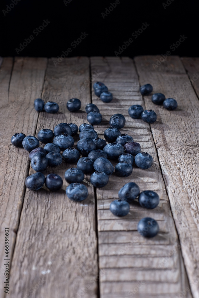 blueberries on a wooden table in a rustic style blueberries on a wooden table in a rustic style