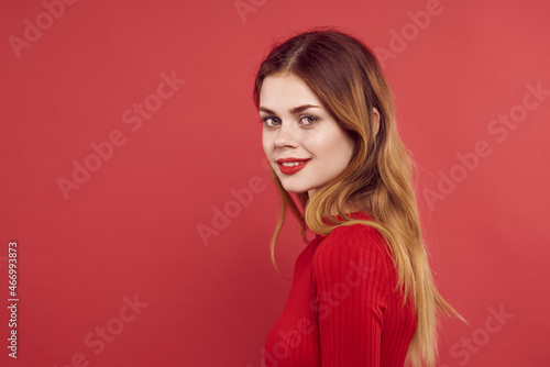 woman in red dress smile hairstyle makeup