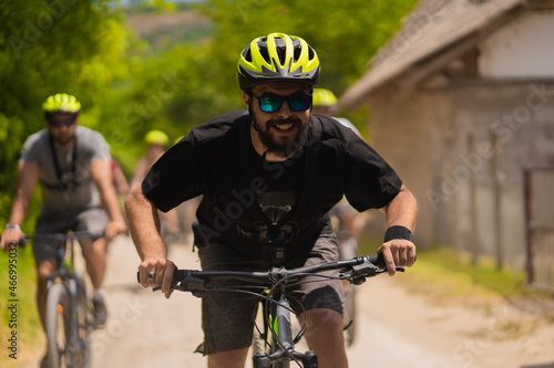 Fototapeta Naklejka Na Ścianę i Meble -  Portrait of adult riding bike