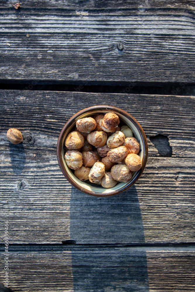 peeled hazelnuts in a small bowl peeled hazelnuts in a small bowl