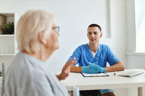 elderly woman patient is examined by a doctor health care