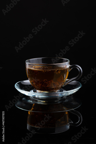 cup of hot black tea with cookies