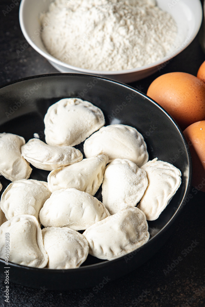 vareniki homemade raw dumplings stuffed ready to eat meal snack on the table copy space food background rustic vareniki homemade raw dumplings stuffed ready to eat meal snack on the table copy space food background rustic