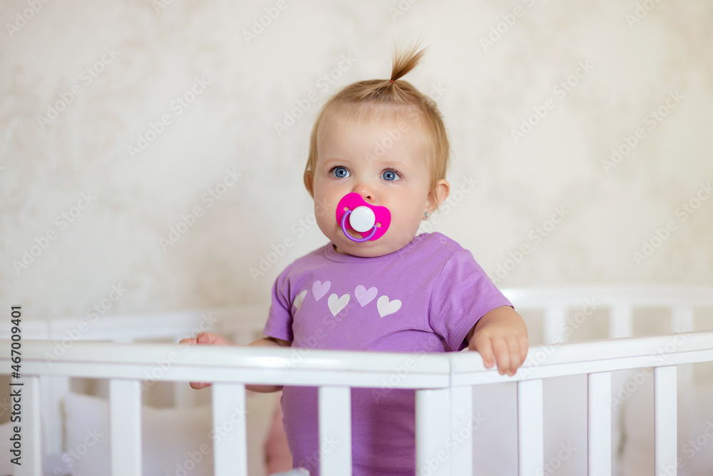 healthy baby playing and smiling in a crib healthy baby playing and smiling in a crib