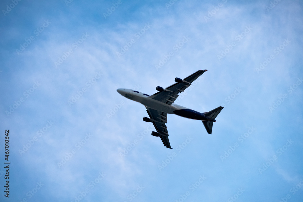 Passenger plane flying on blue sky background Passenger plane flying on blue sky background