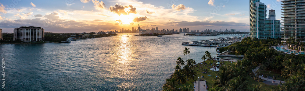 Fototapeta premium Aerial panorama view of Miami beach bayfront scene at sunset