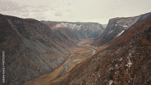 Katu Yaryk mountain pass in the valley of the Chulyshman River, Altai, Siberia, Russia. A huge stone gorge, a canyon, a mountain winding river, a dangerous serpentine highway. Freedom, loneliness
