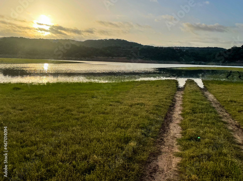 Wallpaper Mural sunrise over the river next to dirt road Torontodigital.ca