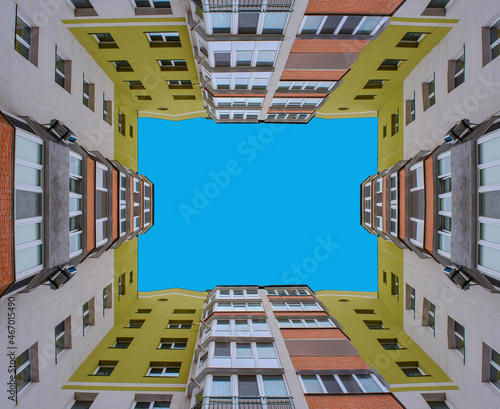 Photo of square building with blue sky