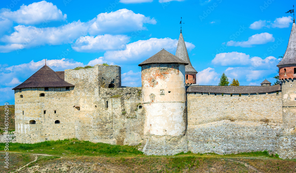 Photo of ancient stone castle with many hight towers in Kamyanets-Podilsky