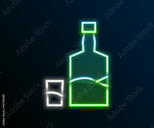 Glowing neon line Tequila bottle and shot glass icon isolated on black background. Mexican alcohol drink. Colorful outline concept. Vector