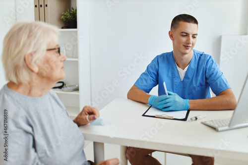 elderly woman talking to doctor health care