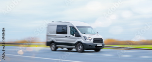 The minibus goes on a suburban highway