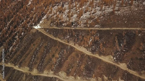 Katu Yaryk mountain pass in the valley of the Chulyshman River, Altai, Siberia, Russia. A dangerous empty serpentine highway, a huge stone gorge, a canyon, a mountain winding river. Freedom