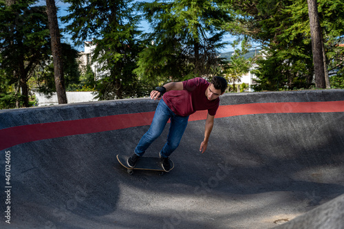 Skateboarder practice on a pump track park