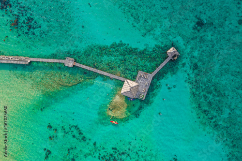 Wooden beach bar in sea and hut on pier in koh Mak island, Trat, Thailand