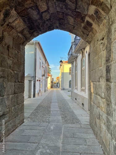 View  of Rua Direita through clock tower arch, Caminha,  Norte, Portugal photo