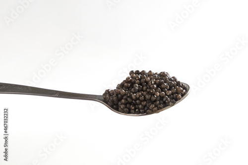Black caviar close up isolated white background