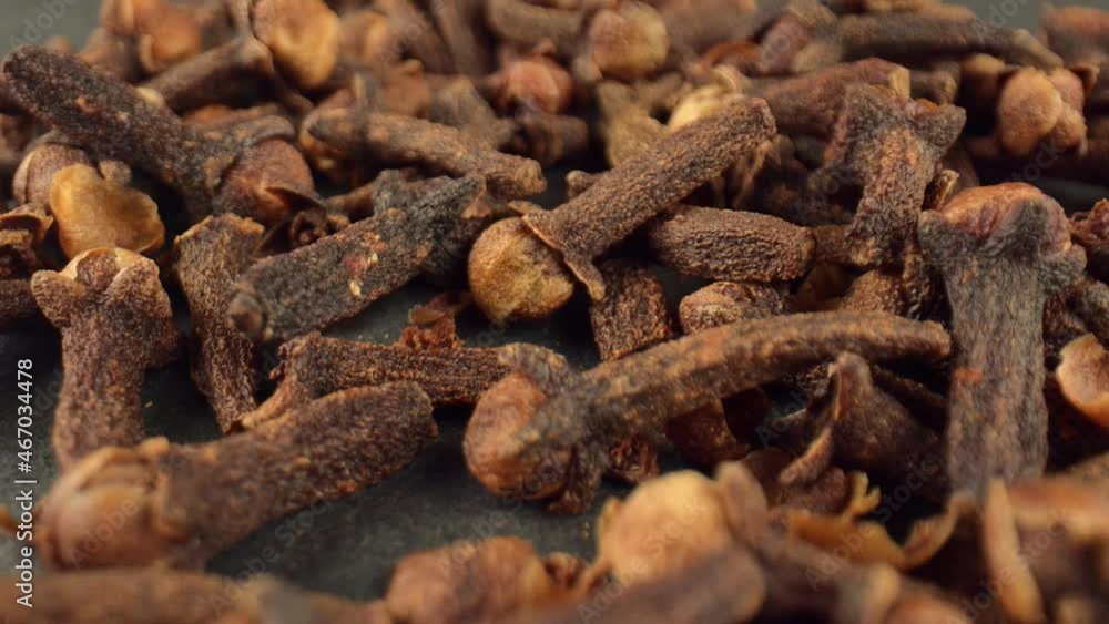 Dried buds of carnation flowers on a dark background. Spices for cooking. Dried cloves with a strong aroma and burning taste. High quality. 4k footage. Dried buds of carnation flowers on a dark background. Spices for cooking. Dried cloves with a strong aroma and burning taste. High quality. 4k footage.