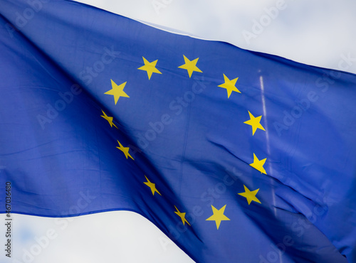 Official flag of the European Union in front of a blue sky