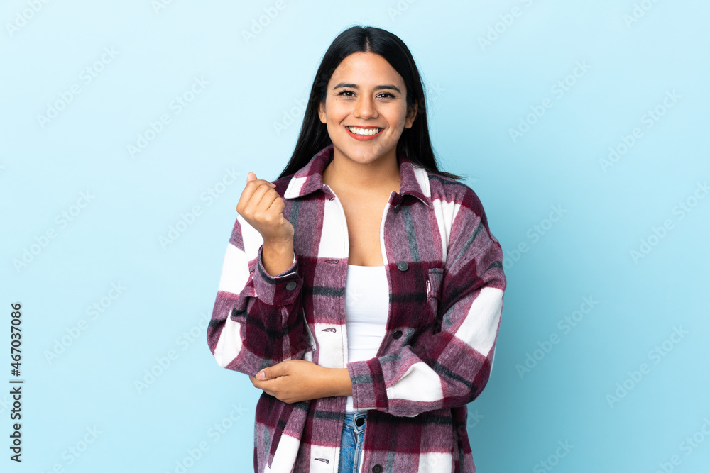 Young latin woman woman isolated on blue background laughing Young latin woman woman isolated on blue background laughing
