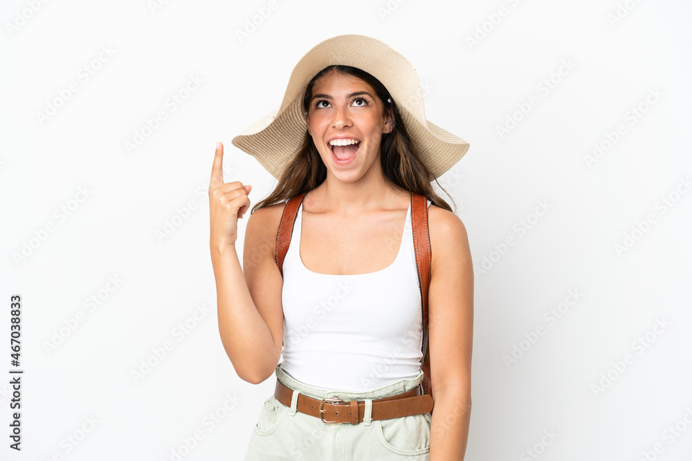 Young caucasian woman wearing a Pamela in summer holidays isolated on white background pointing up and surprised Young caucasian woman wearing a Pamela in summer holidays isolated on white background pointing up and surprised