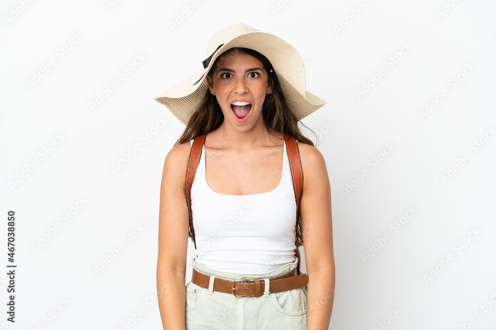 Young caucasian woman wearing a Pamela in summer holidays isolated on white background with surprise facial expression Young caucasian woman wearing a Pamela in summer holidays isolated on white background with surprise facial expression