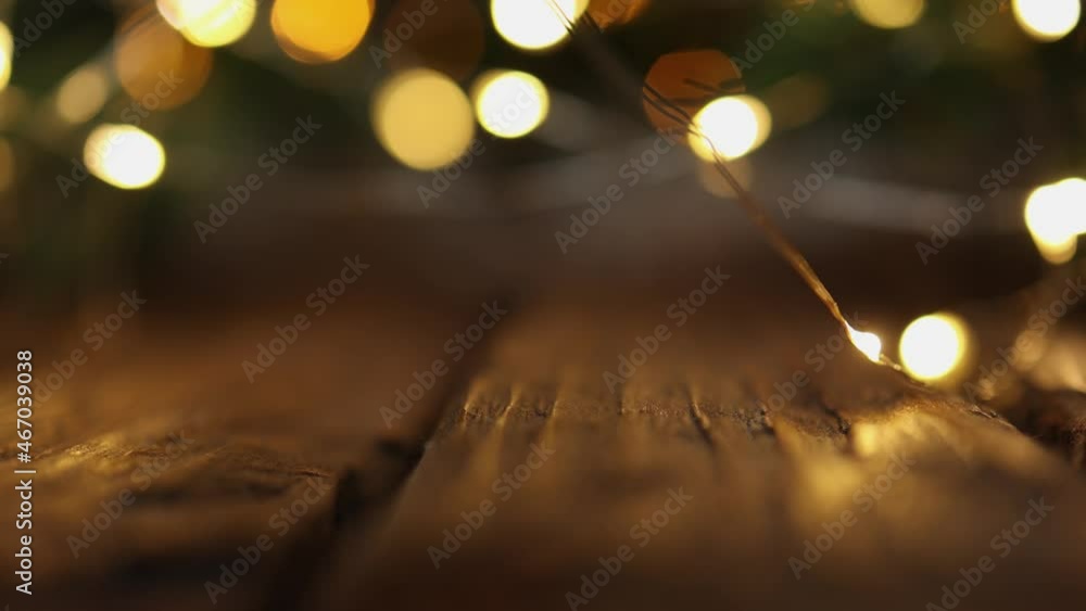 defocused decoration x-mas Christmas fir tree with blurred defocused blinking bokeh yellow lights in soft focus on wooden brown table. winter holidays mood concept background defocused decoration x-mas Christmas fir tree with blurred defocused blinking bokeh yellow lights in soft focus on wooden brown table. winter holidays mood concept background