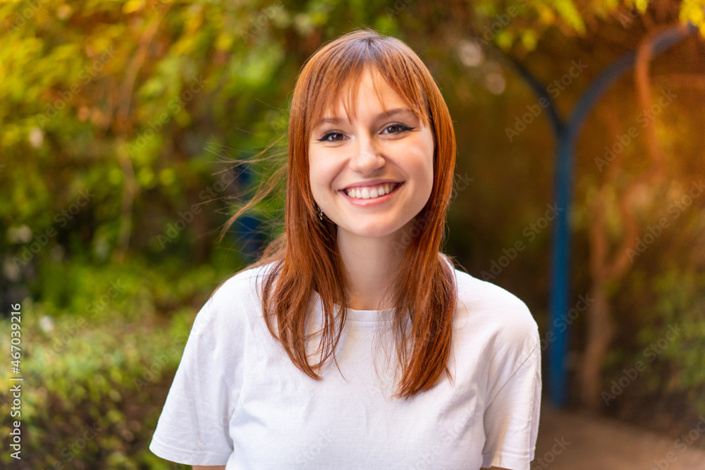 Young pretty redhead woman at outdoors With happy expression Young pretty redhead woman at outdoors With happy expression