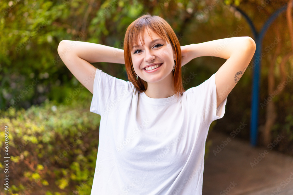 Young pretty redhead woman at outdoors With happy expression Young pretty redhead woman at outdoors With happy expression