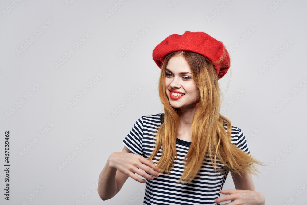 pretty woman wearing a red hat makeup France Europe fashion posing light background pretty woman wearing a red hat makeup France Europe fashion posing light background