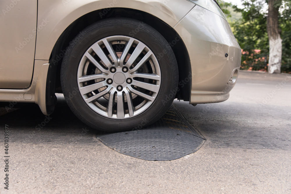 A car artificial unevenness to reduce speed on the road. A car artificial unevenness to reduce speed on the road.