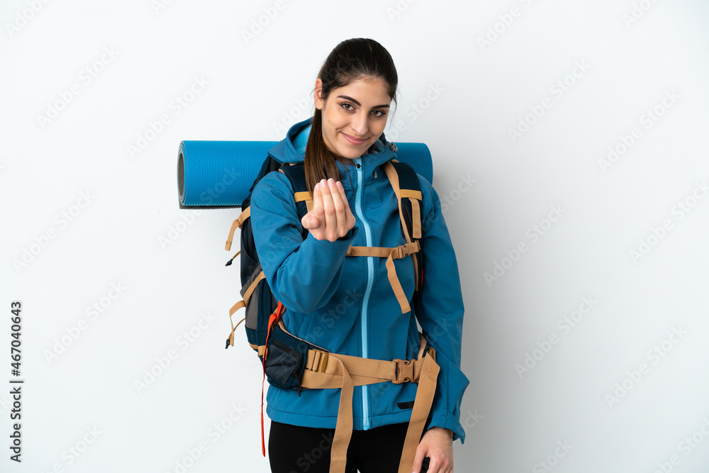 Young mountaineer man with a big backpack over isolated background inviting to come with hand. Happy that you came Young mountaineer man with a big backpack over isolated background inviting to come with hand. Happy that you came