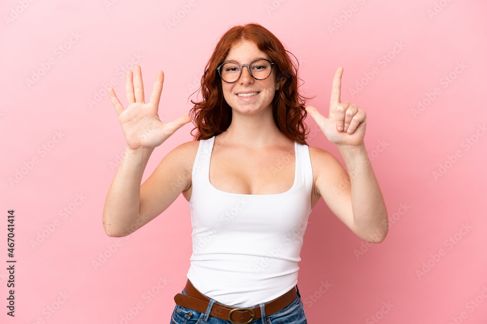Teenager reddish woman isolated on pink background counting seven with fingers Teenager reddish woman isolated on pink background counting seven with fingers