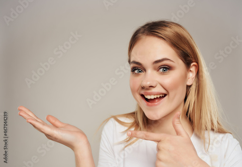 pretty blonde woman in t-shirt bright makeup close-up