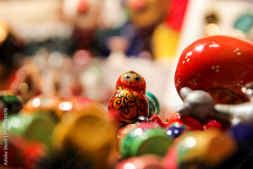 Handmade wooden Russian stacking dolls on display at the Christmas market of the Champs Elysées in Paris, France - Traditional painted soviet matriochka