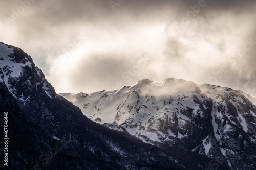 Snowy mountain top with sunset light