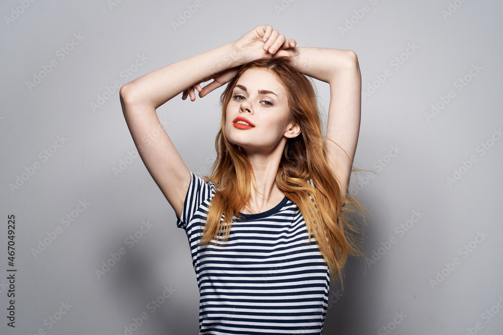 beautiful woman holding hair makeup posing fun fashion expression isolated background