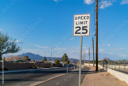 25 miles Speed Limit sign on the road