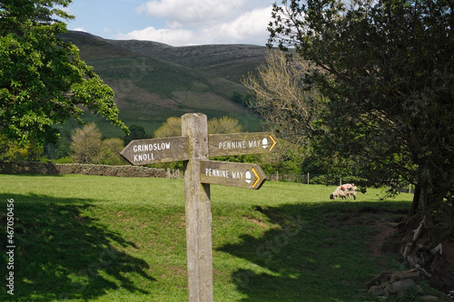 Signpost indicating the direction of the Pennine Way footpath, just leaving Edale Derbyshire England. Peak District National Park. photo