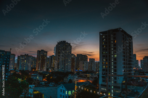 Aerial view of office buildings in Hanoi, a central business district in Vietnam. Beautiful sunset in the urban cityscape. © Leohoho
