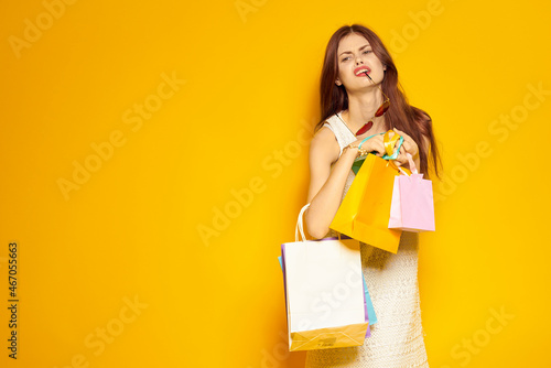 glamorous woman wearing sunglasses posing shopping fashion studio model