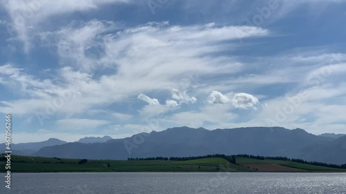 Glistening waters of the Theewaterskloof dam green farmlands in the background photo