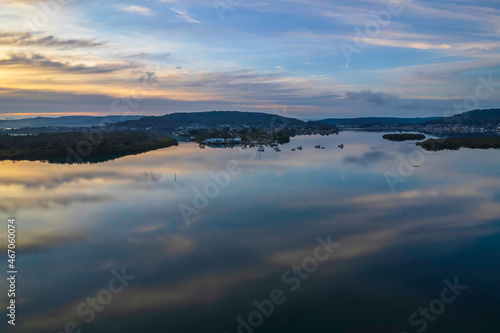 Sunrise and cloud reflections waterscape