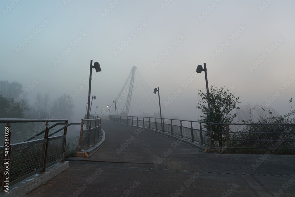 The Herrenkrugsteg, a suspension bridge over the river Elbe on the Elbe cycle path near Magdeburg in the fog