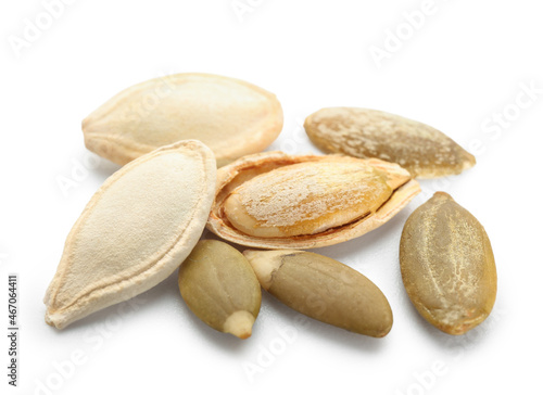 Pile of natural pumpkin seeds on white background