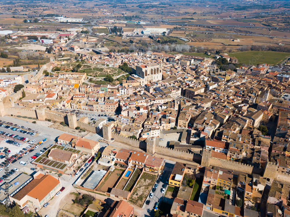 Fototapeta premium View from drone of Montblanc cityscape with battlements of fortress wall, Tarragona, Spain
