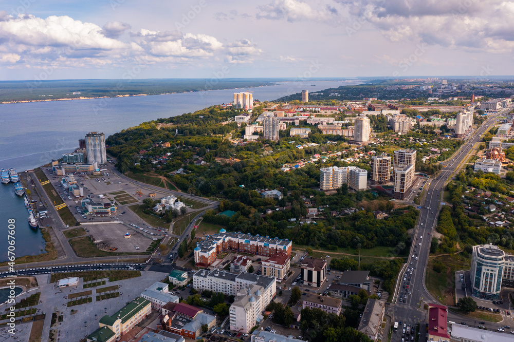 Scenic general aerial view of Cheboksary cityscape on banks of Volga River on sunny summer day, Chuvashia, Russia