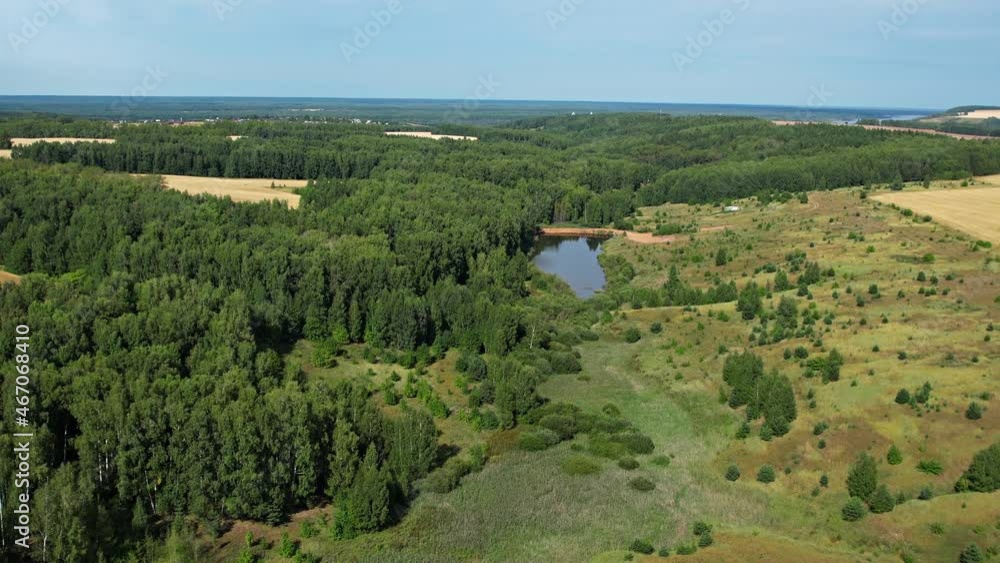 Flying over green fields and forests.Hot summer.Sunny.Aerial photography Flying over green fields and forests.Hot summer.Sunny.Aerial photography