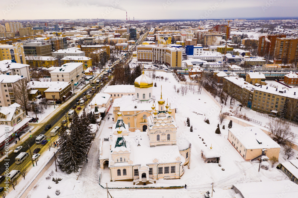 Fototapeta premium Winter aerial view of Orthodox Holy Trinity Monastery in snow covered Penza city in Russia